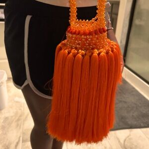 Hand made orange bead and fringe bag